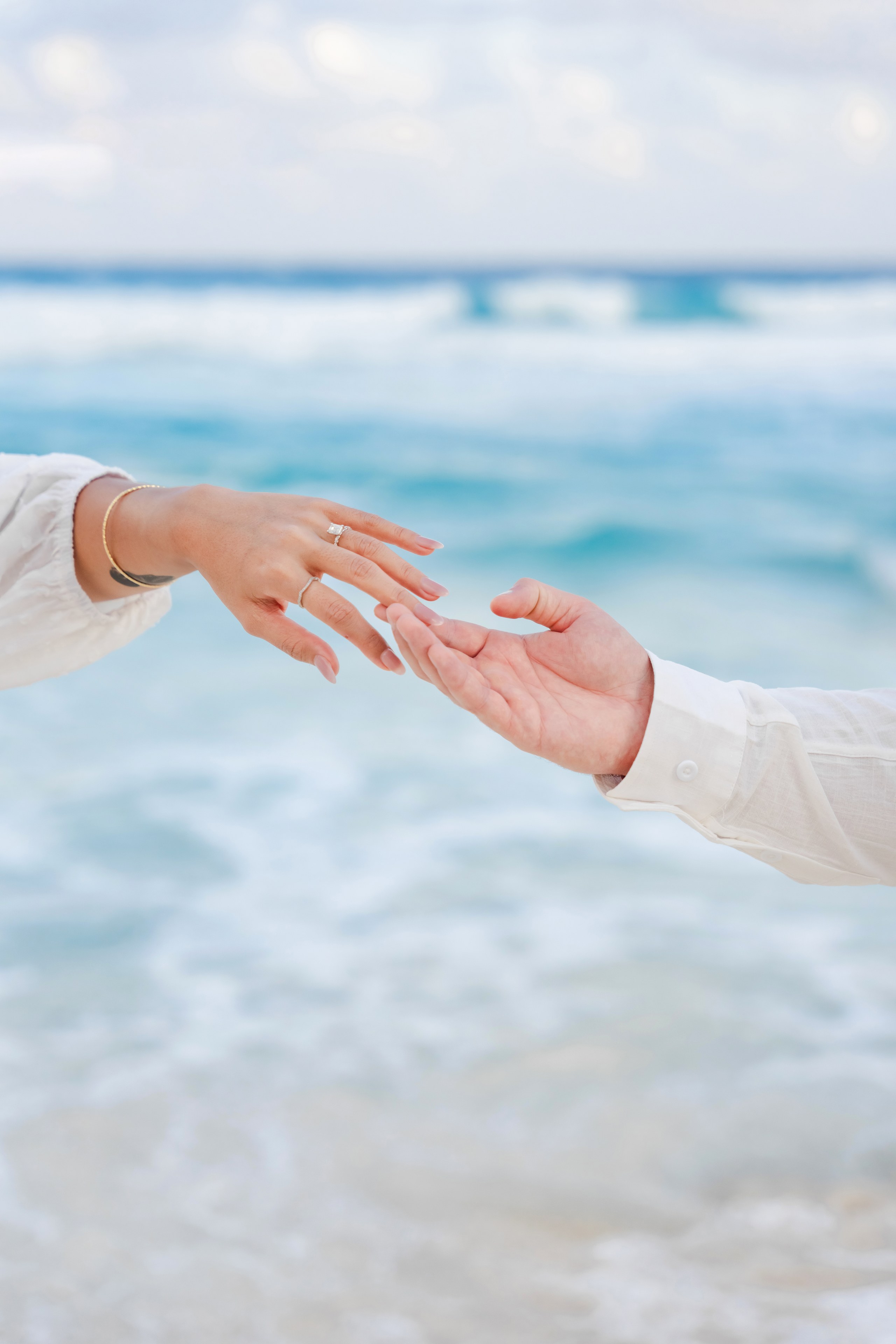 Couple on Cancun beach barefoot