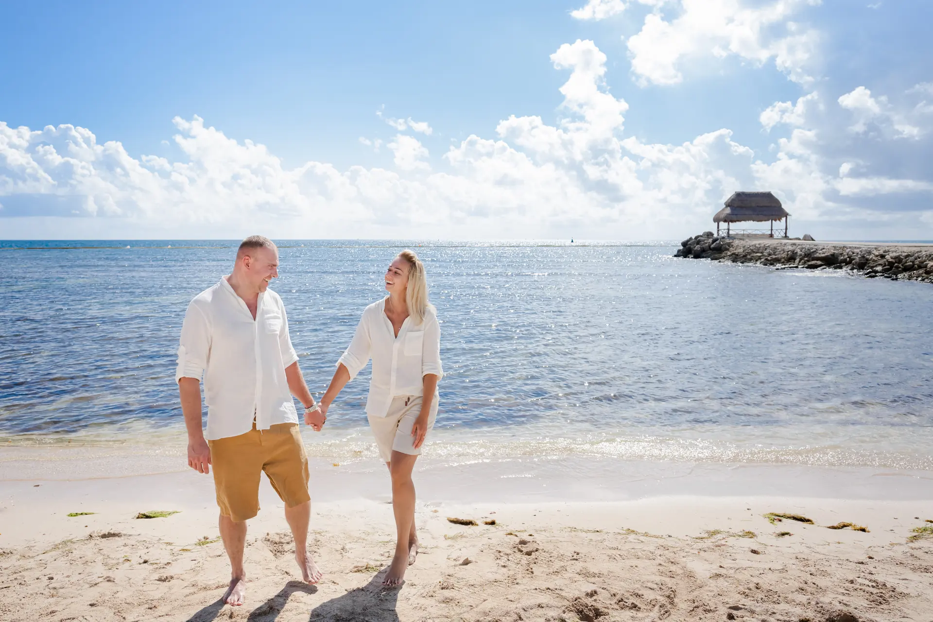 Couple photo session at sunset on Cancun Hotel Zone beach by IVAE Studios luxury resort photographer