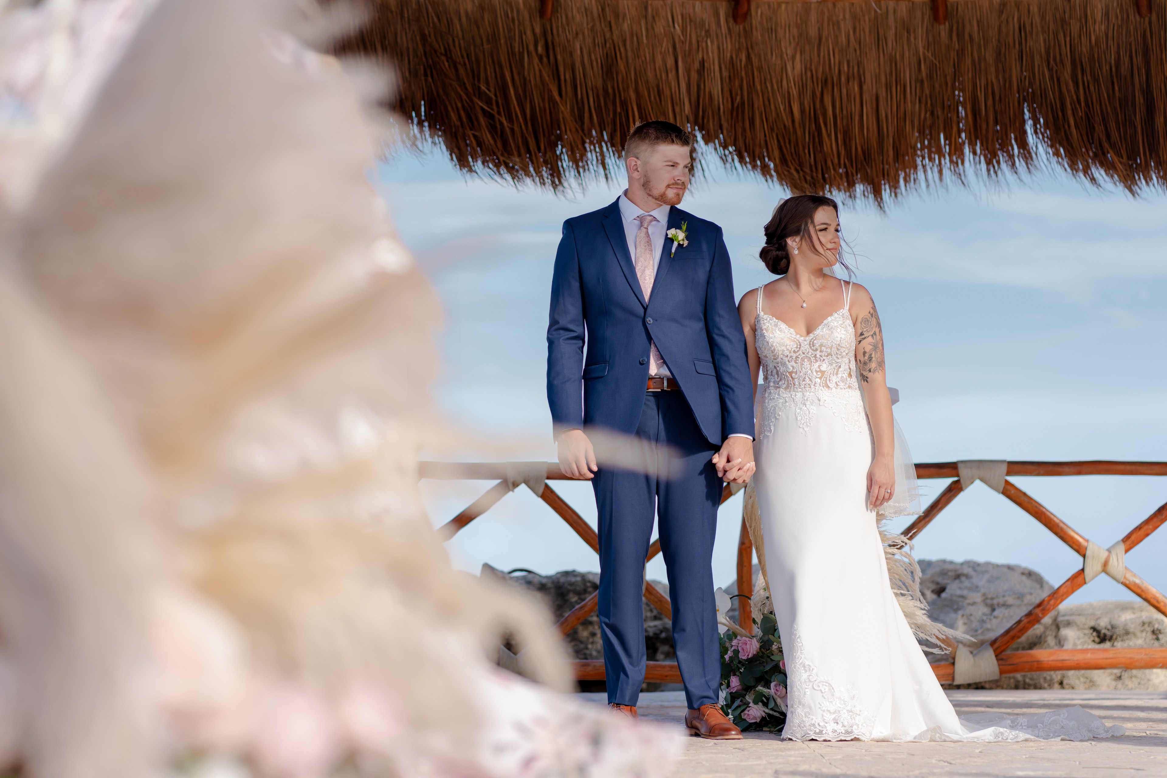Bride at a Cancún beach in an editorial bridal portrait by IVAE Studios