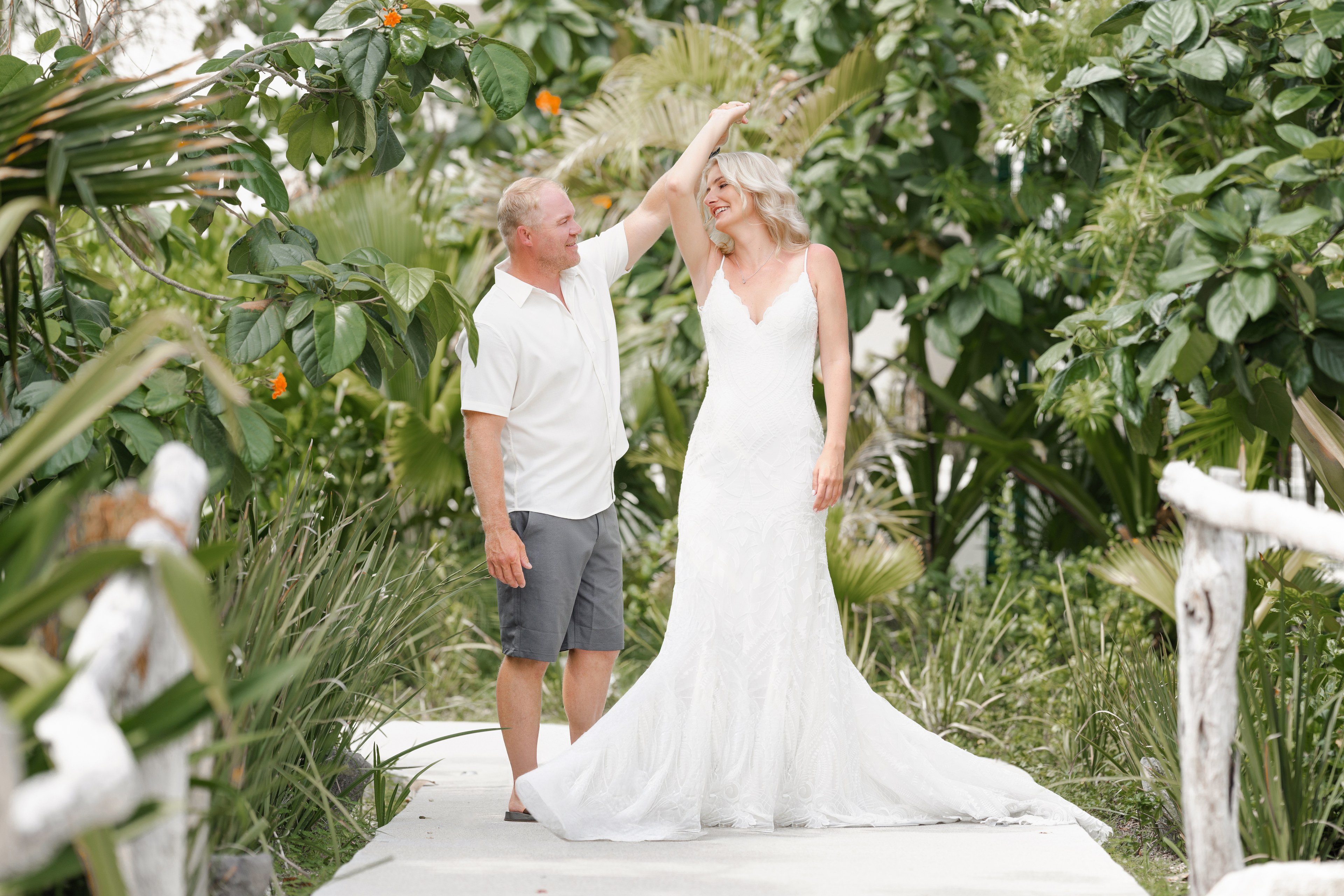 Bride at the Cancún Hotel Zone framed by palms by IVAE Studios