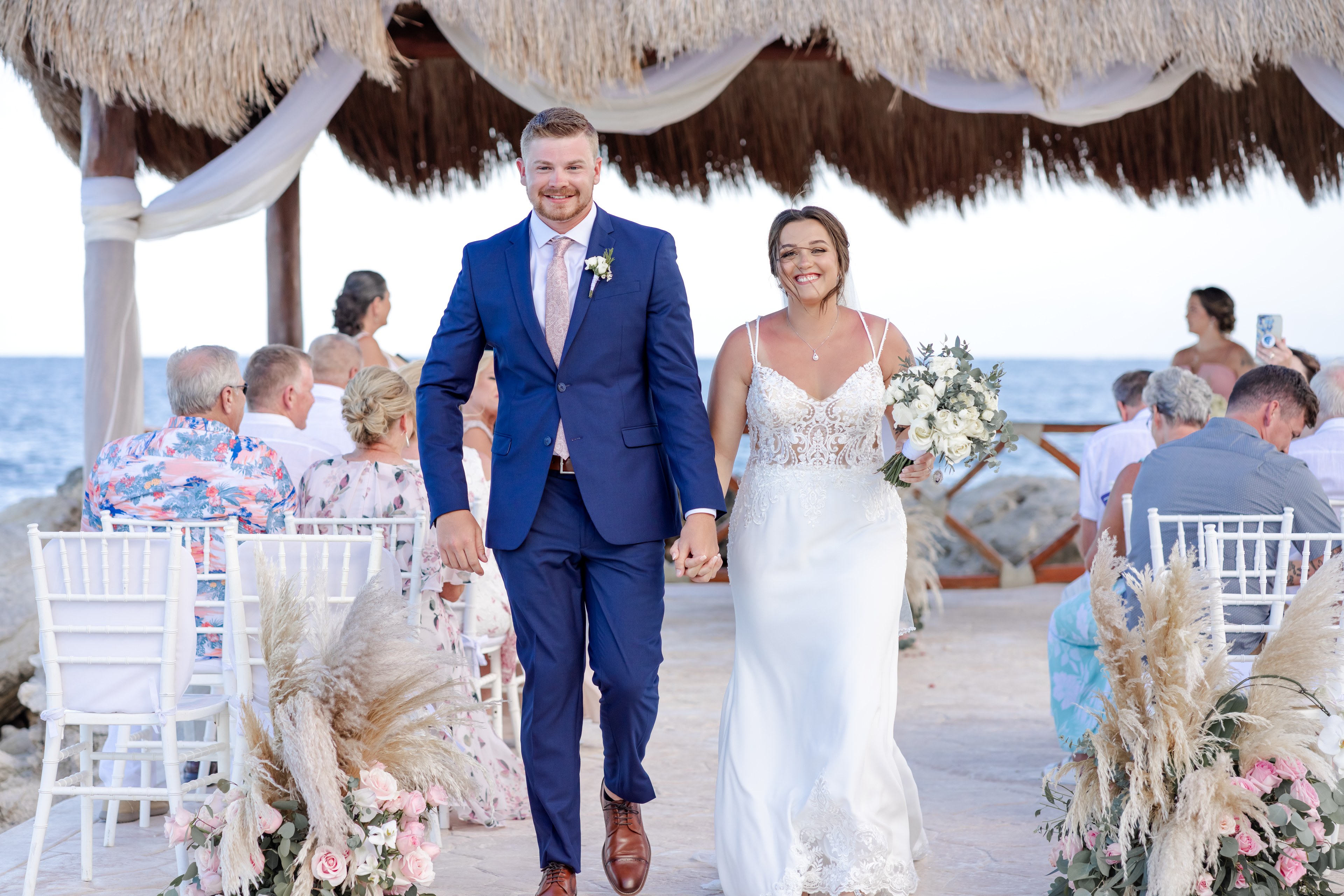 Groom on a Cancún beach before the ceremony, by IVAE Studios