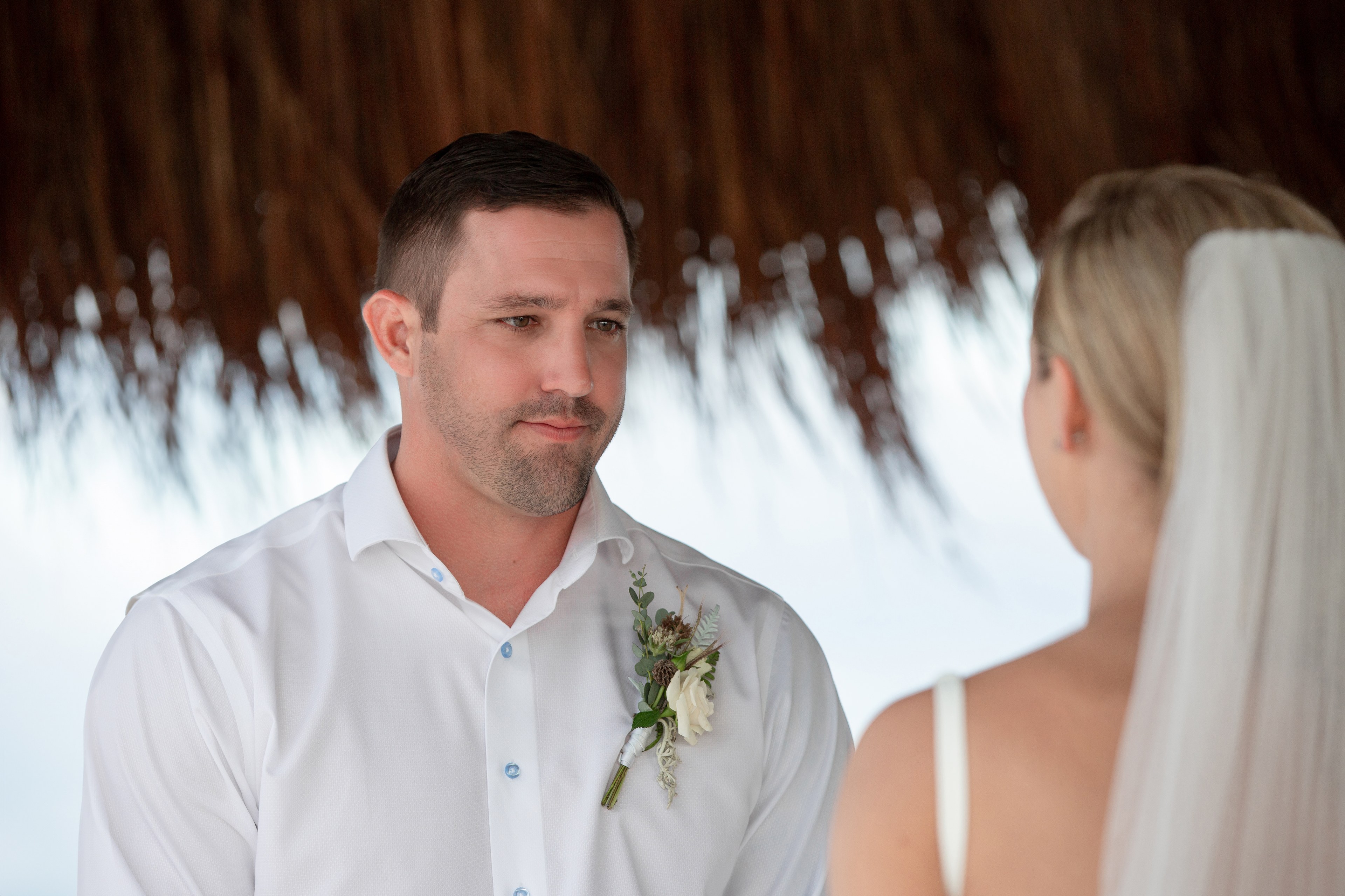 Groom portrait on Mayakoba beach photographed by IVAE Studios luxury wedding photographer